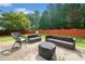 Cozy backyard patio with comfortable seating, ideal for relaxing outdoors at 1450 Liberty Ln, Cumming, GA 30040