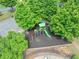 Aerial view of a well-maintained community playground with modern play equipment and mature trees at 1450 Liberty Ln, Cumming, GA 30040