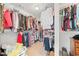 Spacious walk-in closet featuring organized shelving and ample storage for clothes and accessories at 1450 Liberty Ln, Cumming, GA 30040