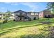 Large backyard features lush landscaping and mature trees at 1749 W Caribaea Se Trl, Atlanta, GA 30316
