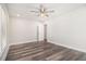 Bright bedroom featuring sleek flooring, modern ceiling fan, and lots of natural light at 1749 W Caribaea Se Trl, Atlanta, GA 30316