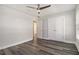 Cozy bedroom with wood floors, white trim, and a large window for natural light at 1749 W Caribaea Se Trl, Atlanta, GA 30316