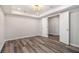 Bright bedroom with new gray flooring, recessed lights, and freshly painted walls at 1749 W Caribaea Se Trl, Atlanta, GA 30316