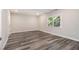 Bright bedroom with modern flooring and a large window offering natural light at 1749 W Caribaea Se Trl, Atlanta, GA 30316