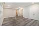 Spacious bedroom with wood-look floors, neutral paint, and a double-door closet at 1749 W Caribaea Se Trl, Atlanta, GA 30316