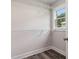 Bright closet featuring custom shelving and a window offering natural light at 1749 W Caribaea Se Trl, Atlanta, GA 30316