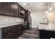 Updated kitchen with stainless steel appliances, granite counters, and modern lighting at 1749 W Caribaea Se Trl, Atlanta, GA 30316