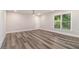Living room featuring sleek flooring, natural light, and a ceiling fan at 1749 W Caribaea Se Trl, Atlanta, GA 30316