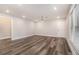 Spacious living room featuring recessed lighting, a ceiling fan, and sleek flooring at 1749 W Caribaea Se Trl, Atlanta, GA 30316