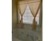 Bathroom with a soaking tub, decorative window, and neutral tones, offering a tranquil retreat at 222 Yardsley Dr, Mcdonough, GA 30253
