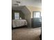 A cozy bedroom with carpet, a window with blinds, and dark wood furniture at 222 Yardsley Dr, Mcdonough, GA 30253
