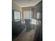 Bright and airy bedroom with a window, dresser, treadmill and a wall-mounted television at 222 Yardsley Dr, Mcdonough, GA 30253