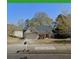 Charming one-story home with mature trees, attached garage, and well-maintained landscaping at 222 Yardsley Dr, Mcdonough, GA 30253