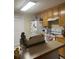 Functional kitchen features wooden cabinets and essential appliances at 222 Yardsley Dr, Mcdonough, GA 30253