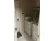 Functional laundry room equipped with a washer, dryer, and storage shelves for efficient organization at 222 Yardsley Dr, Mcdonough, GA 30253
