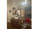 Cozy living room featuring a ceiling fan, fireplace, and neutral-toned sofa at 222 Yardsley Dr, Mcdonough, GA 30253