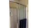 Bathroom shower featuring glass doors and a tiled interior, creating a clean and functional space at 222 Yardsley Dr, Mcdonough, GA 30253