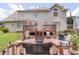 Backyard patio with a wooden deck with an outdoor seating area with chairs and tables at 3574 Timberloch Trl, Snellville, GA 30039