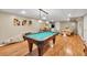 Spacious basement featuring a pool table, entertainment area, and ample space for recreation and relaxation at 3574 Timberloch Trl, Snellville, GA 30039
