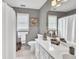 Stylish bathroom with white vanity, a large mirror, and a shower with a curtain at 3574 Timberloch Trl, Snellville, GA 30039
