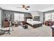 Bright bedroom with carpeting, neutral tones, and natural light through a large window at 3574 Timberloch Trl, Snellville, GA 30039