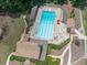 Aerial view of a large, inviting community swimming pool with lounge chairs, and a clubhouse at 3574 Timberloch Trl, Snellville, GA 30039