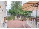 Charming wooden deck with cozy outdoor seating and a shade umbrella at 3574 Timberloch Trl, Snellville, GA 30039