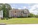 Charming brick home with blue shutters and a well-manicured front yard at 3574 Timberloch Trl, Snellville, GA 30039