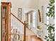 Bright foyer view with wood floors, staircase and welcome decor at 3574 Timberloch Trl, Snellville, GA 30039
