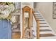 Inviting foyer showcases staircase and grandfather clock, adding a touch of elegance at 3574 Timberloch Trl, Snellville, GA 30039