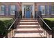 Inviting brick front entrance with blue door, shutters, and manicured landscaping at 3574 Timberloch Trl, Snellville, GA 30039