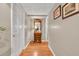 Hallway with a wood floor, neutral paint, and built in nook at 3574 Timberloch Trl, Snellville, GA 30039