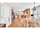 Spacious eat-in kitchen with tile floor, wooden cabinets, and large windows for plenty of natural light at 3574 Timberloch Trl, Snellville, GA 30039