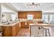 Bright kitchen with wood cabinets, stainless steel appliances, and an island at 3574 Timberloch Trl, Snellville, GA 30039