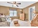 Cozy living room with a ceiling fan, neutral tones, and comfortable furnishings at 3574 Timberloch Trl, Snellville, GA 30039
