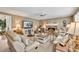 Open-concept living room with a fireplace, TV, and plenty of seating at 3574 Timberloch Trl, Snellville, GA 30039