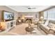 Spacious living room featuring a brick fireplace, and comfortable furniture at 3574 Timberloch Trl, Snellville, GA 30039