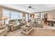 Cozy living room with neutral colors, plush seating, and bright natural light at 3574 Timberloch Trl, Snellville, GA 30039