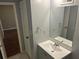 Clean bathroom with a bright vanity, large mirror, and updated hardware at 3674 Riverchase Ter, Decatur, GA 30034