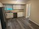 The kitchen has new floors, stainless steel appliances, and white cabinets at 3674 Riverchase Ter, Decatur, GA 30034
