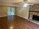 Living room showcases stone fireplace and wood floors at 3674 Riverchase Ter, Decatur, GA 30034