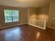 Bright living room with hardwood floors and a large window at 3674 Riverchase Ter, Decatur, GA 30034