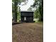 Back view of a two-story home with an expansive backyard at 2351 Carver Nw Dr, Atlanta, GA 30314