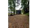 Exterior of a home with a spacious backyard and mature trees at 2351 Carver Nw Dr, Atlanta, GA 30314