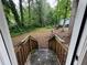 View of wooded backyard with fallen tree from the top of the back porch stairs at 2351 Carver Nw Dr, Atlanta, GA 30314