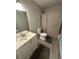 Bathroom featuring a vanity, toilet, and tub with a shower curtain at 2351 Carver Nw Dr, Atlanta, GA 30314