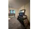 A cozy bedroom featuring comfortable furnishings and a stylish TV set at 2351 Carver Nw Dr, Atlanta, GA 30314