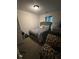 A well-lit bedroom featuring a cozy bed and comfortable furnishings at 2351 Carver Nw Dr, Atlanta, GA 30314