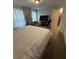 Bedroom with bed, mirrored closet, TV, and storage bins at 2351 Carver Nw Dr, Atlanta, GA 30314