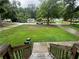 A view from the front porch showing the home's lawn, trees, and the peaceful neighborhood street at 2351 Carver Nw Dr, Atlanta, GA 30314
